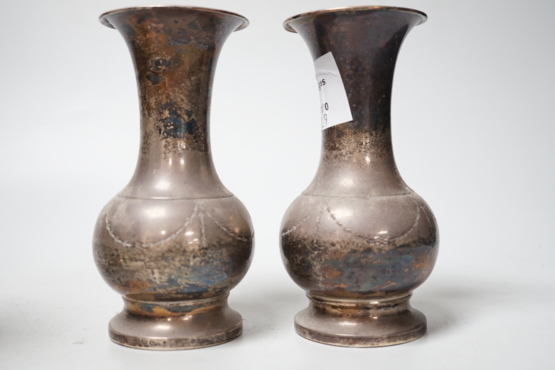 A pair of George V silver mounted spill vases, Birmingham, 1934, 14.2cm, weighted.